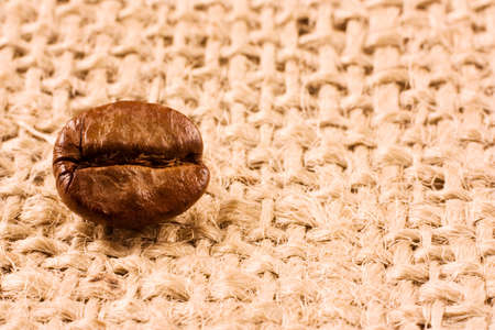 Coffee bean on a jute backgroundの写真素材