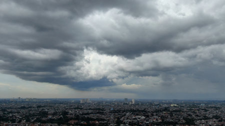 Rain clouds over the city. Panoramic view of the city.の写真素材