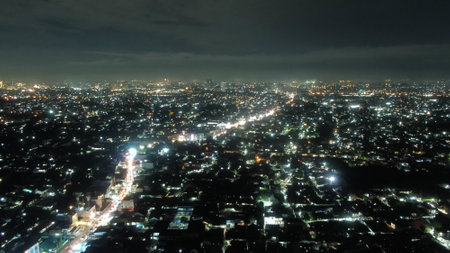 Depok cityscape at night, Indonesia. Panoramic view.の写真素材