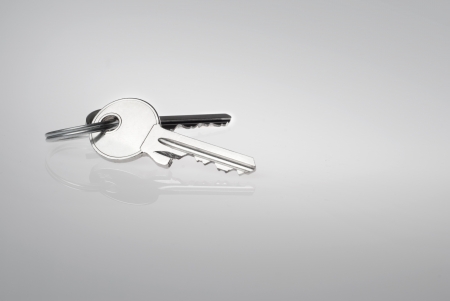 two silver keys on the grey backgroundの写真素材