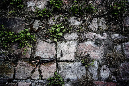 Grunge background of ruined brick wallの写真素材