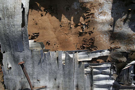 Grunge background of ruined wooden wall
