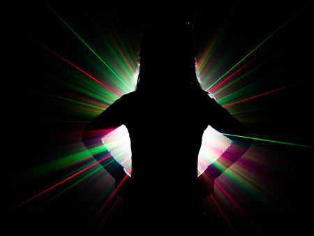 silhouette of woman dancing on abstract backgroundの写真素材