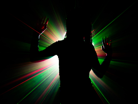 silhouette of woman dancing on abstract backgroundの写真素材