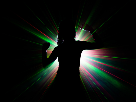 silhouette of woman dancing on abstract backgroundの写真素材