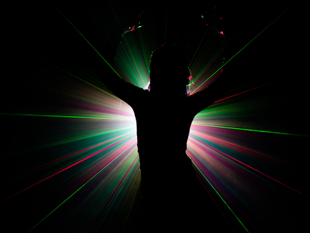 silhouette of woman dancing on abstract backgroundの写真素材