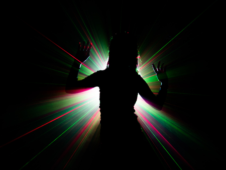 silhouette of woman dancing on abstract backgroundの写真素材