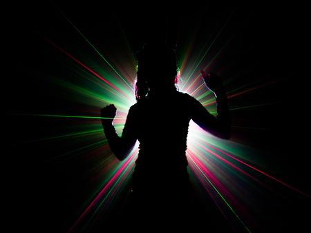 silhouette of woman dancing on abstract backgroundの写真素材