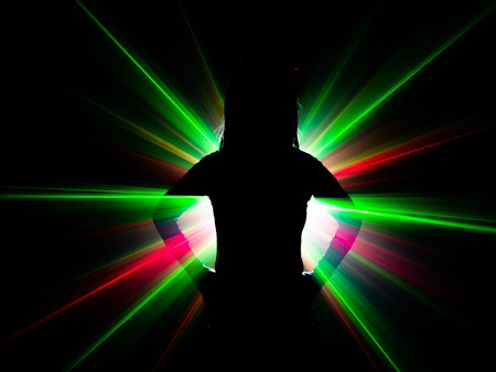 silhouette of woman dancing on abstract backgroundの写真素材