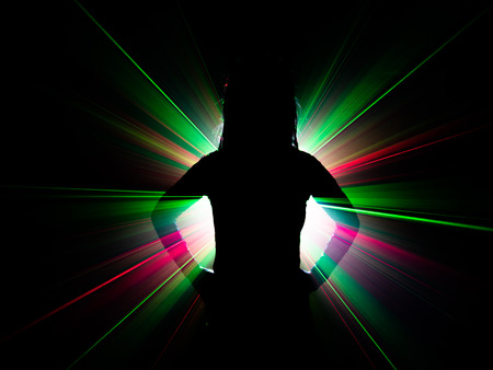 silhouette of woman dancing on abstract backgroundの写真素材