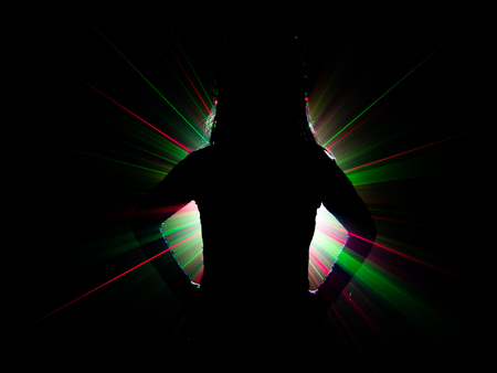 silhouette of woman dancing on abstract backgroundの写真素材