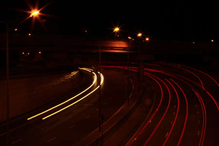 streaks of car lights on the street at night