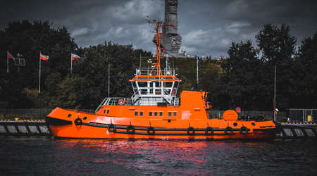 A large cargo ship moored in the shipbuilding canal in GdaÅskの写真素材