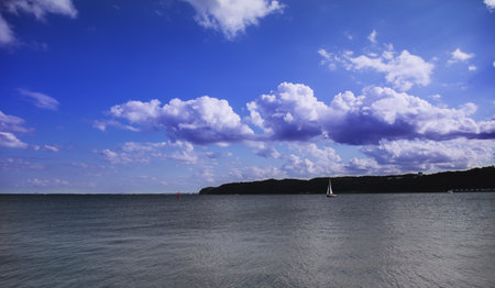 sea bay with sailboats against the blue sky