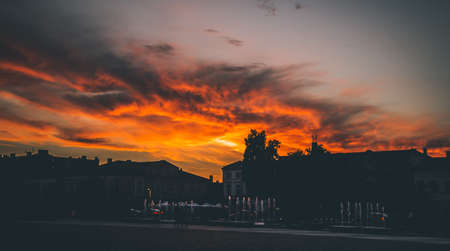 Atmospheric sunset over an old teptak in a small townの写真素材