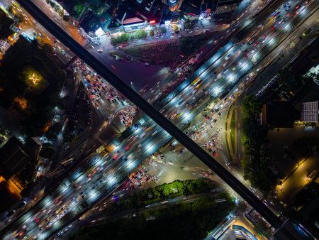 Aerial view of evening traffic at an intersection in Hanoi, Vietnam.