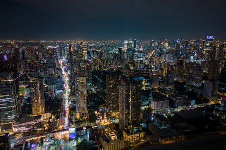 Aerial view of traffic and the Bangkok city skyline at night, Thailandの写真素材