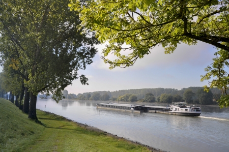 Barge on the Danube river, in Bavaria  Germany  at late summerの写真素材