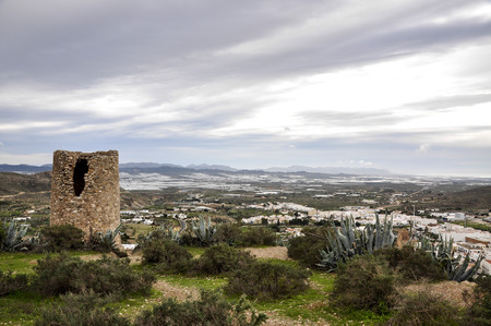Atalaya watchtower and greenhouses in background, Nijar - Almeria  Spain の写真素材