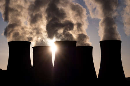 cooling towers at sunset. coal fired power station and Combined cycle power plant