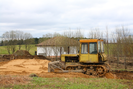 Tractor at the houseの写真素材
