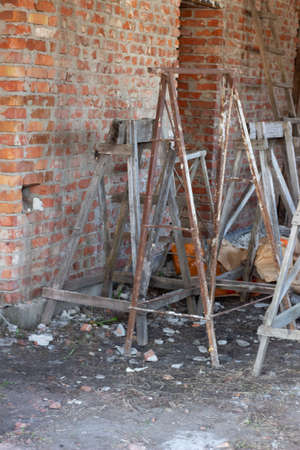 Partially built residential housing building site with homes in early stages of construction. Buckets, wooden boards and standsの写真素材