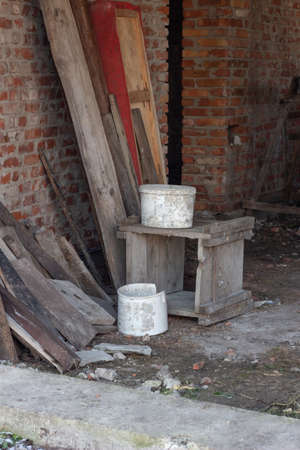 Partially built residential housing building site with homes in early stages of construction. Buckets, wooden boards and standsの写真素材