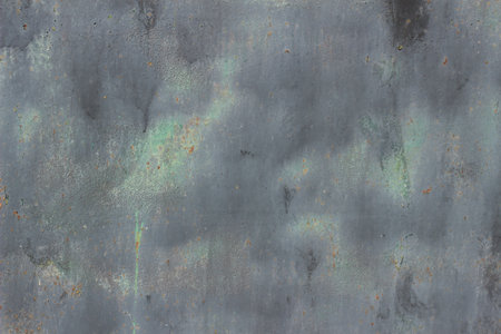 Texture of a rusty scratched metal surface with peeling and peeling old paintの写真素材