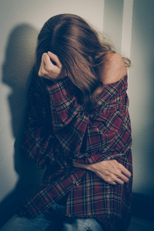 Woman abuse victim. Domestic violence, harassment, depression, drug addiction, human trafficking. PTSD post-traumatic stressの写真素材