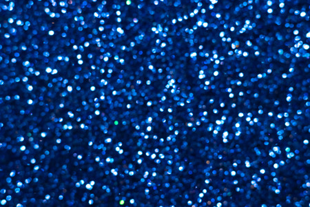 Golden glitter festive background with bokeh lights. Celebration concept for Holidays and...