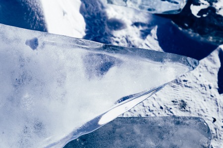 Blocks of ice gleaming in the sun. Arctic winter background. ice textureの写真素材