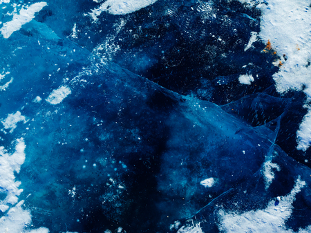 Blue ice texture. Abstract arctic winter background. Winter ice along the shore.の写真素材