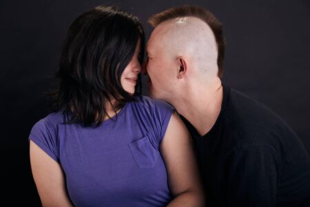 Portrait of mixed race couple in the studio. Two people together.の写真素材