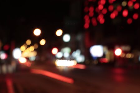 Abstract defocused city street scene at nightの写真素材