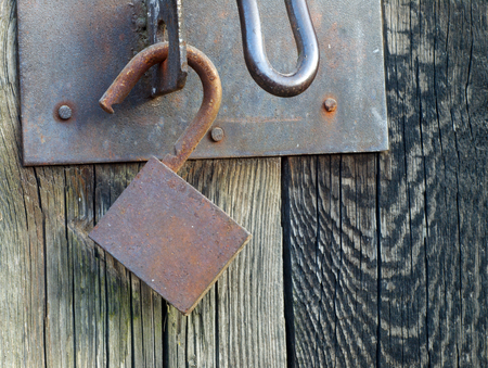 Old metal padlock. A large amount of rust.の写真素材