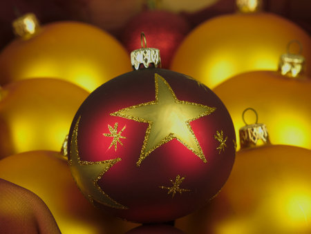 Red and gold Christmas balls encased in a stylish old wooden crate.の写真素材