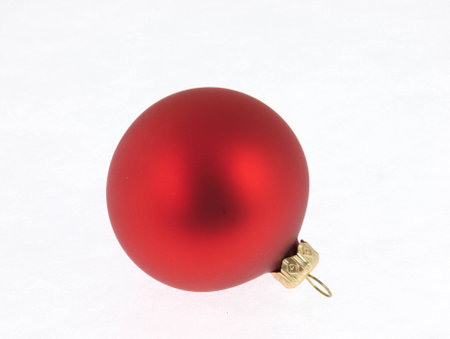 Red Christmas Tree bauble on a white background.の写真素材