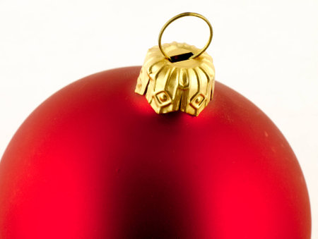 Red Christmas Tree bauble on a white background.の写真素材