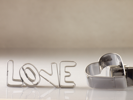 The heart and love on a white background with metal molds.の写真素材