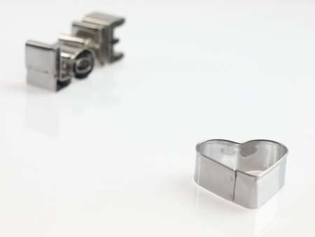 The heart and love on a white background with metal molds.の写真素材