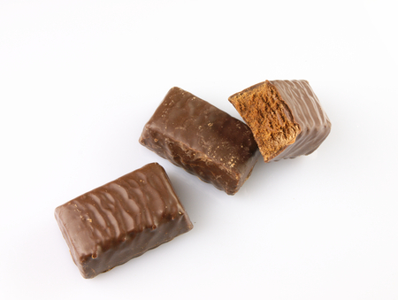 Bitten chocolate Candy-flavored chocolate truffles. On a white background.の写真素材