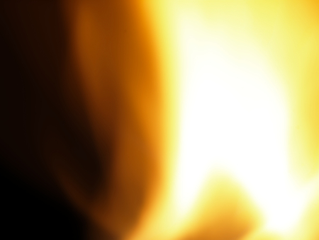 Hot, orange flames seen from close up on black background.の写真素材