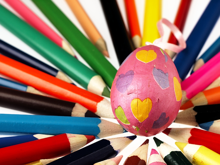 Wooden crayons and Easter egg. The visible spectrum of colors. Arranged in a circle.の写真素材