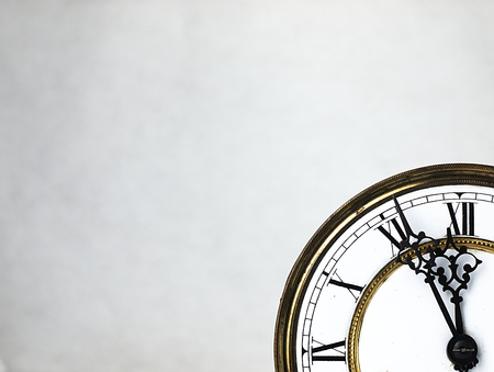 Mechanism of old clock. Clock face and hands showing five minutes to midnight.の写真素材