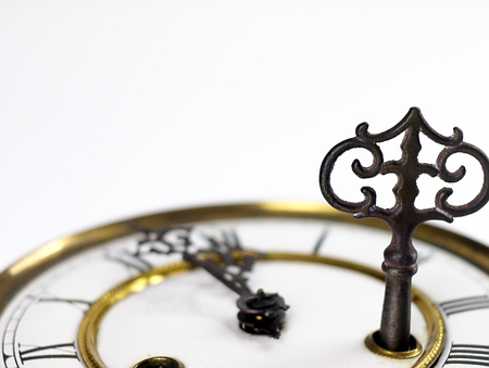 Mechanism of old clock. Clock face and hands showing five minutes to midnight.の写真素材