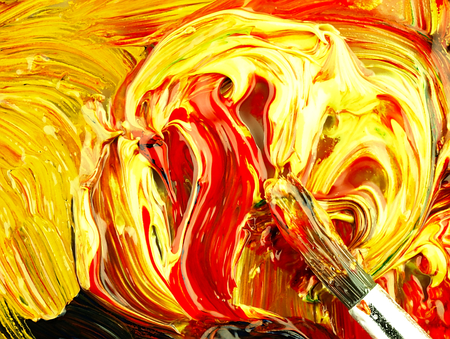 Paints and brush up on the pallet. Different colors mixed in multi-colored mass. Visible texture paint.の写真素材