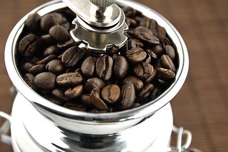 Coffee beans in an old coffee grinder.の写真素材