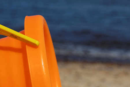 The sea, sandy beach and children's toys.の写真素材
