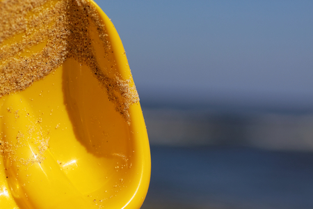 The sea, sandy beach and children's toys.の写真素材