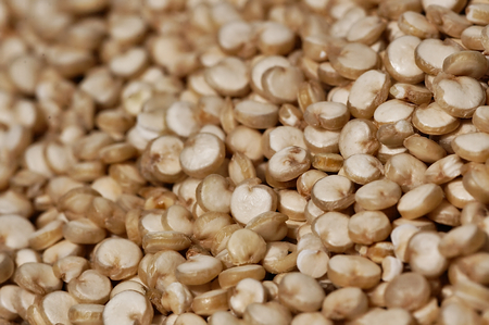 Grain quinoa scattered on the wooden surface.の写真素材
